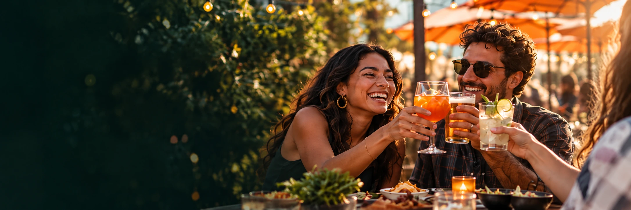 Friends toasting at an outdoor restaurant